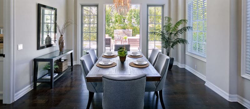 Formal dining room with dark hardwood floor