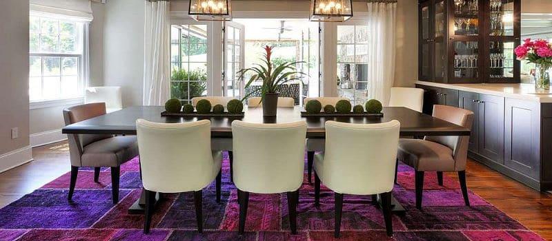 Bold purple patterned carpet in dining room
