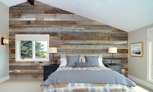 Recycled plank flooring used to create mosaic effect accent wall.