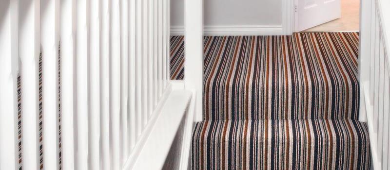 Luxury striped carpet on stairs and landing