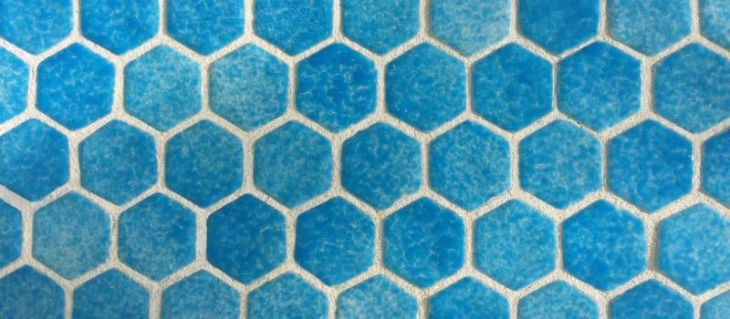 close up of hexagon blue glass mosaic tiles