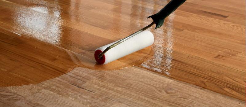close up polyurethane application on hardwood floor