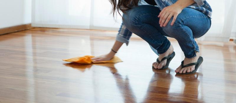 woman buffing laminate flooring