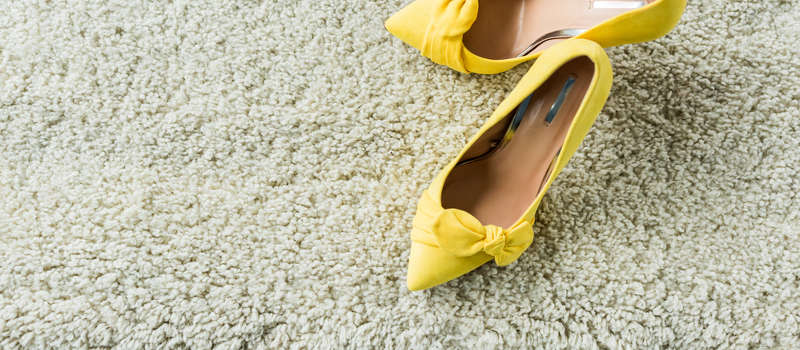 yellow shoes on cream carpet