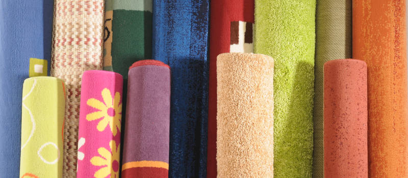 a selection of colorful carpets and rugs