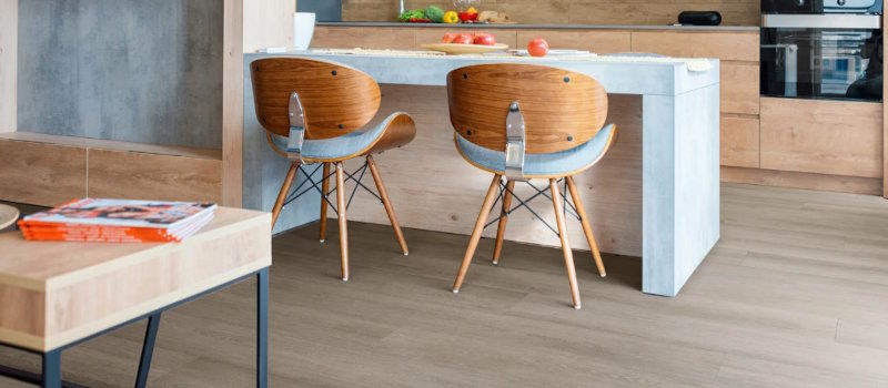 Grey-brown wood-look vinyl plank in a kitchen and living room